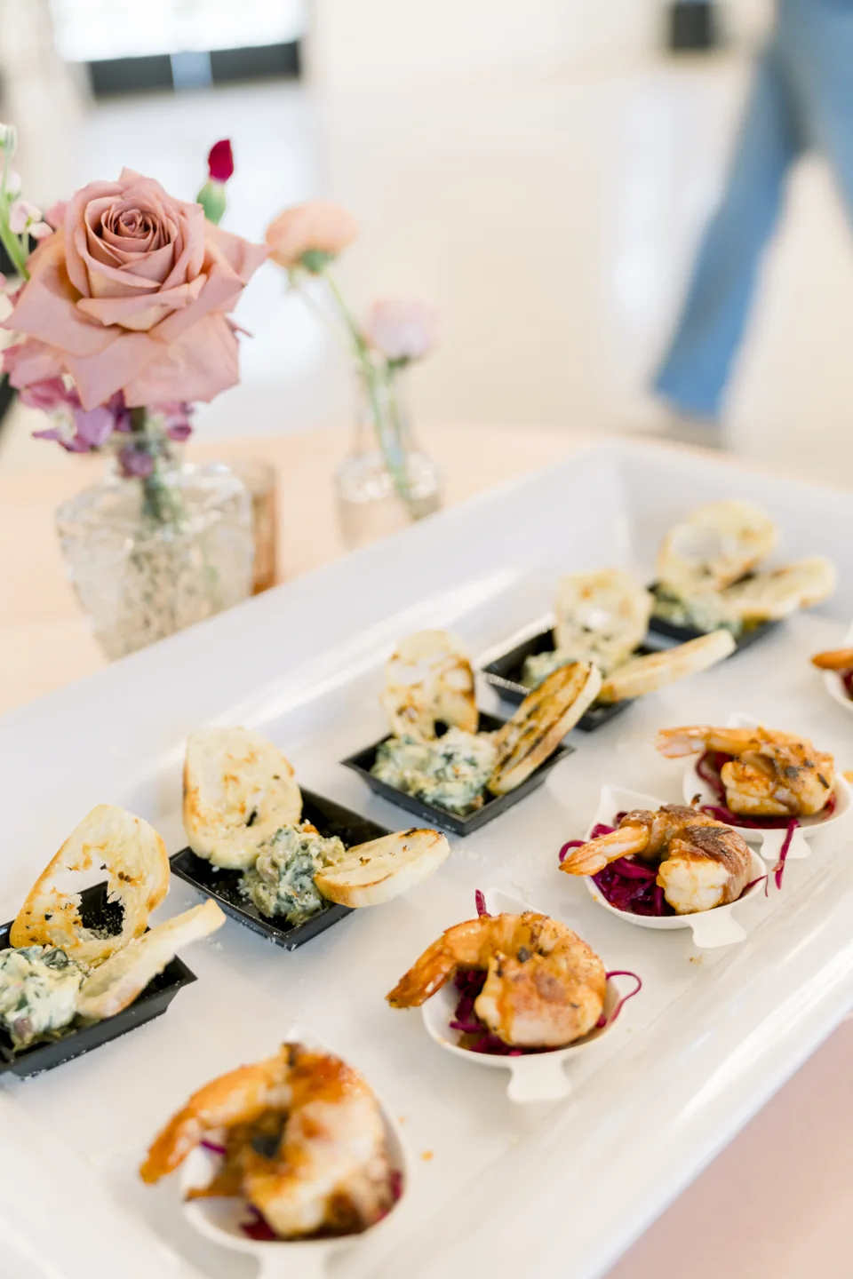 Small appetizers arranged on individual dishes