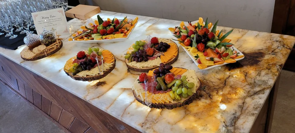 Fruit, cheese and vegetables arranged for a catered gathering