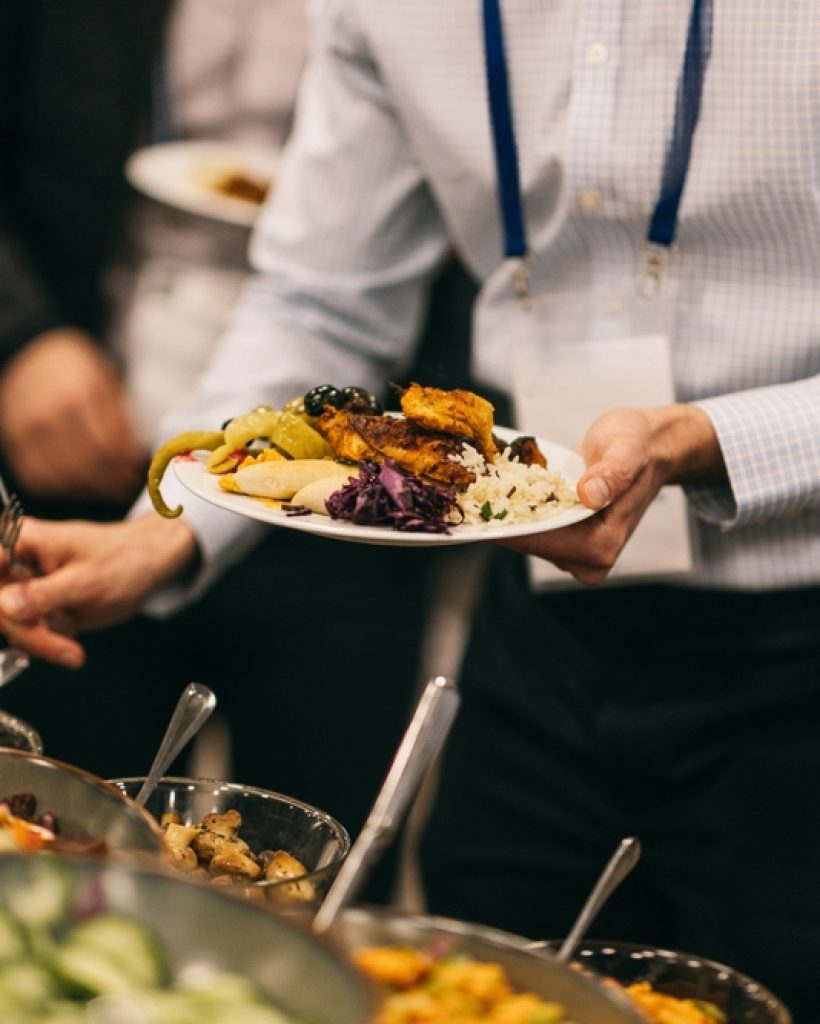 Man,In,Formal,Shirt,Holding,A,Vibrant,Plate,Of,Mediterranean